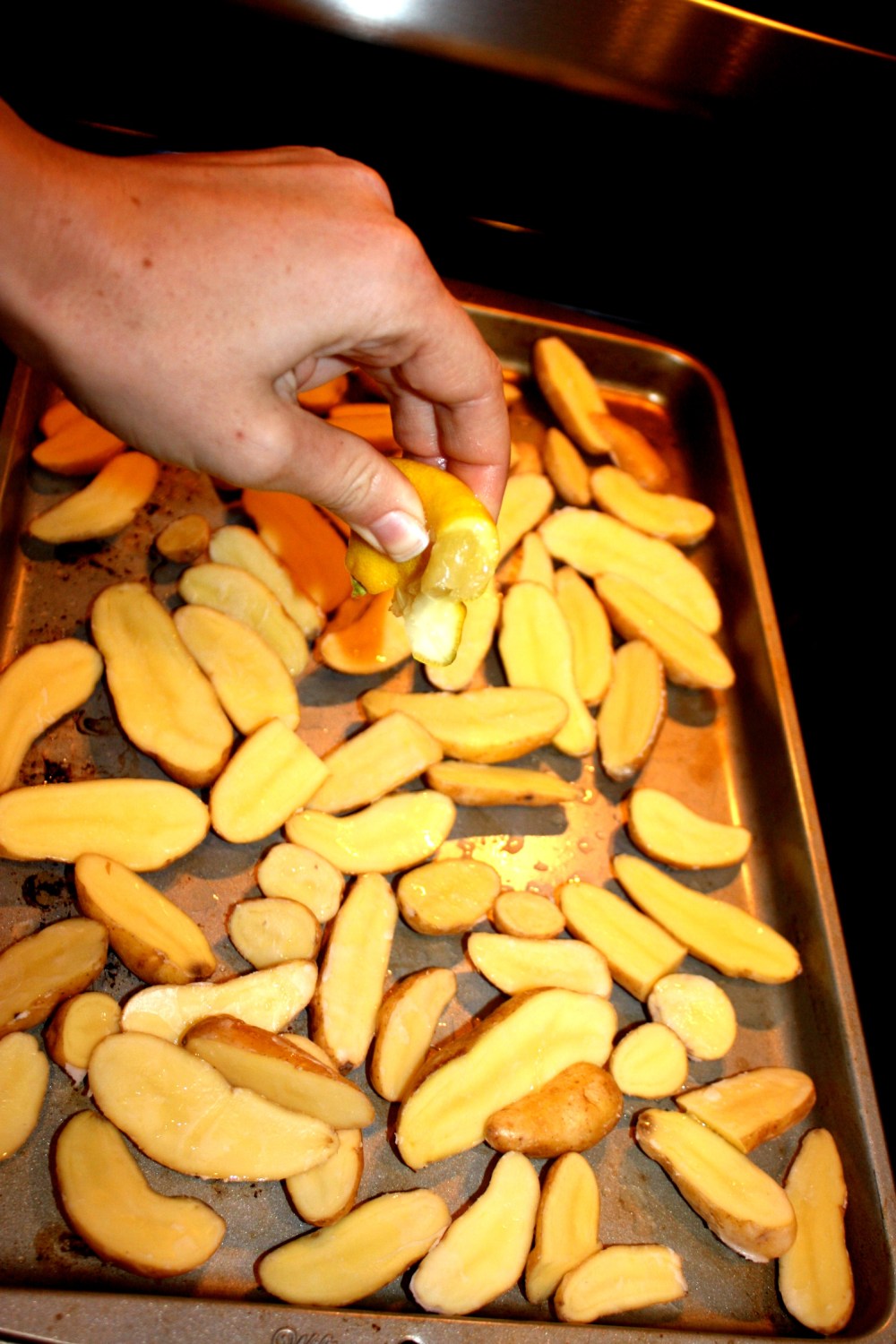 mixed the potatoes around in a ziplock with warm coconut oil + then squirted lemon over top 