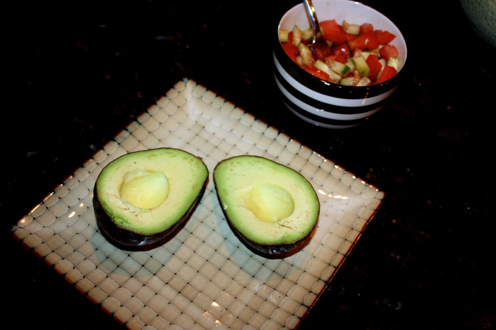 halved avocado w/side of tomato, cucumber, balsalmic vinegar + olive oil
